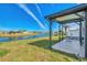 Covered patio overlooking a tranquil canal at 812 Seabrooke Dr, Englewood, FL 34223