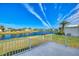 Spacious patio overlooking a tranquil lake in a 55+ community at 812 Seabrooke Dr, Englewood, FL 34223