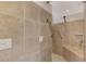Walk-in shower with grab bars and tiled walls at 812 Seabrooke Dr, Englewood, FL 34223