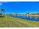 Serene waterfront view of a canal and lush green landscape at 812 Seabrooke Dr, Englewood, FL 34223