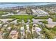 Aerial perspective of home on a canal, near the bay at 900 Oxford Dr, Englewood, FL 34223