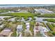 Aerial view showcasing a waterfront home nestled amongst mangroves at 900 Oxford Dr, Englewood, FL 34223