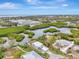 Aerial showcasing waterfront home and surrounding landscape at 900 Oxford Dr, Englewood, FL 34223