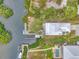 Bird's-eye view of canal-front home with private dock and swimming pool at 900 Oxford Dr, Englewood, FL 34223