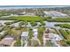 Aerial view of waterfront home with lush landscaping and private dock at 900 Oxford Dr, Englewood, FL 34223