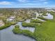 Aerial showing waterfront homes, mangrove waterways, and surrounding landscape at 900 Oxford Dr, Englewood, FL 34223