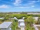 Aerial view of waterfront home with private dock and lush landscaping at 900 Oxford Dr, Englewood, FL 34223