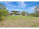 Spacious backyard with two-story home and shed at 900 Oxford Dr, Englewood, FL 34223