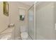 Clean bathroom with toilet and shower, updated fixtures at 900 Oxford Dr, Englewood, FL 34223