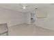 Bedroom with tile floors and access to laundry at 900 Oxford Dr, Englewood, FL 34223
