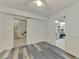 Bedroom with spiral staircase, storage, and wood-look floors at 900 Oxford Dr, Englewood, FL 34223