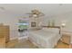 Spacious bedroom with king-size bed and access to a private balcony at 900 Oxford Dr, Englewood, FL 34223