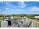 Enjoy grilling and dining on this deck with scenic views at 900 Oxford Dr, Englewood, FL 34223