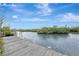 Wooden dock extending over calm water at 900 Oxford Dr, Englewood, FL 34223