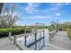 Waterfront dock with boat lift and pilings at 900 Oxford Dr, Englewood, FL 34223