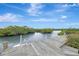Wooden dock offering scenic waterfront views at 900 Oxford Dr, Englewood, FL 34223