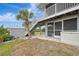 Exterior view showing deck, stairs, shed and landscaping at 900 Oxford Dr, Englewood, FL 34223