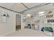 Organized garage with shelving and central vacuum system at 900 Oxford Dr, Englewood, FL 34223