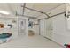 Garage with laundry hookups and ample storage shelving at 900 Oxford Dr, Englewood, FL 34223