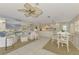 Open concept kitchen with white cabinets and butcher block countertops at 900 Oxford Dr, Englewood, FL 34223