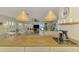 Kitchen boasts a butcher block island and stylish pendant lighting at 900 Oxford Dr, Englewood, FL 34223