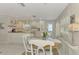 White kitchen with butcher block island and breakfast nook at 900 Oxford Dr, Englewood, FL 34223