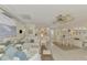 Open living space with white furniture and coastal decor at 900 Oxford Dr, Englewood, FL 34223