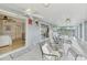 Bright screened porch with access to a bedroom and living area at 900 Oxford Dr, Englewood, FL 34223