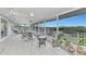 Spacious screened porch with water views, perfect for relaxing and entertaining at 900 Oxford Dr, Englewood, FL 34223