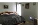 Spacious bedroom with a queen-size bed and window at 914 E 2Nd St, Englewood, FL 34223