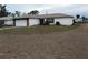 Single-story home with attached garage and spacious yard at 914 E 2Nd St, Englewood, FL 34223