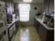 Galley kitchen with ample counter space and appliances at 914 E 2Nd St, Englewood, FL 34223