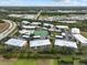 Aerial view of community, pool and tennis courts at 9550 Fiddlers Green Cir # 206, Rotonda West, FL 33947