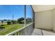 Enjoy serene golf course and water views from this screened balcony at 10045 Links Ln # 203, Rotonda West, FL 33947