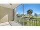 Screened balcony overlooking a peaceful golf course and water at 10045 Links Ln # 203, Rotonda West, FL 33947