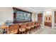 Community clubhouse bar with large fish tank and seating at 10045 Links Ln # 203, Rotonda West, FL 33947