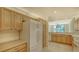 Bright kitchen boasts ample counter space and modern refrigerator at 10045 Links Ln # 203, Rotonda West, FL 33947