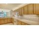 Well-equipped kitchen featuring ample cabinetry and modern appliances at 10045 Links Ln # 203, Rotonda West, FL 33947