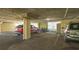 Covered parking garage with spaces for cars and bikes at 10045 Links Ln # 203, Rotonda West, FL 33947