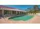 Inviting kidney-shaped swimming pool with brick deck at 10045 Links Ln # 203, Rotonda West, FL 33947
