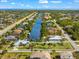 Property view showcasing house, canal, and neighborhood at 10322 Sunbury Dr, Port Charlotte, FL 33981