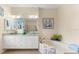Elegant bathroom with double vanity, soaking tub, and view to backyard at 10322 Sunbury Dr, Port Charlotte, FL 33981