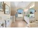 Large bathroom with double vanity, soaking tub, and separate shower at 10322 Sunbury Dr, Port Charlotte, FL 33981