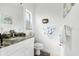 Small bathroom with granite countertop and updated fixtures at 10322 Sunbury Dr, Port Charlotte, FL 33981