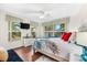 Guest bedroom with a king bed, hardwood floor, and plenty of natural light at 10322 Sunbury Dr, Port Charlotte, FL 33981