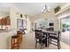 Casual dining area with dark wood table and chairs, adjacent to kitchen at 10322 Sunbury Dr, Port Charlotte, FL 33981