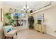 Bright dining area with large window and decorative cabinet at 10322 Sunbury Dr, Port Charlotte, FL 33981