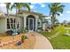 Landscaped front yard with a walkway leading to the front door at 10322 Sunbury Dr, Port Charlotte, FL 33981