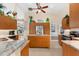 Open kitchen boasts granite counters, ample cabinetry, and stainless steel appliances at 10322 Sunbury Dr, Port Charlotte, FL 33981