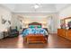 Main bedroom with wood floors, bay window, and relaxing sitting area at 10322 Sunbury Dr, Port Charlotte, FL 33981